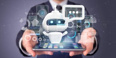 businessman-holding-chatbot-with-binary-code-message-data